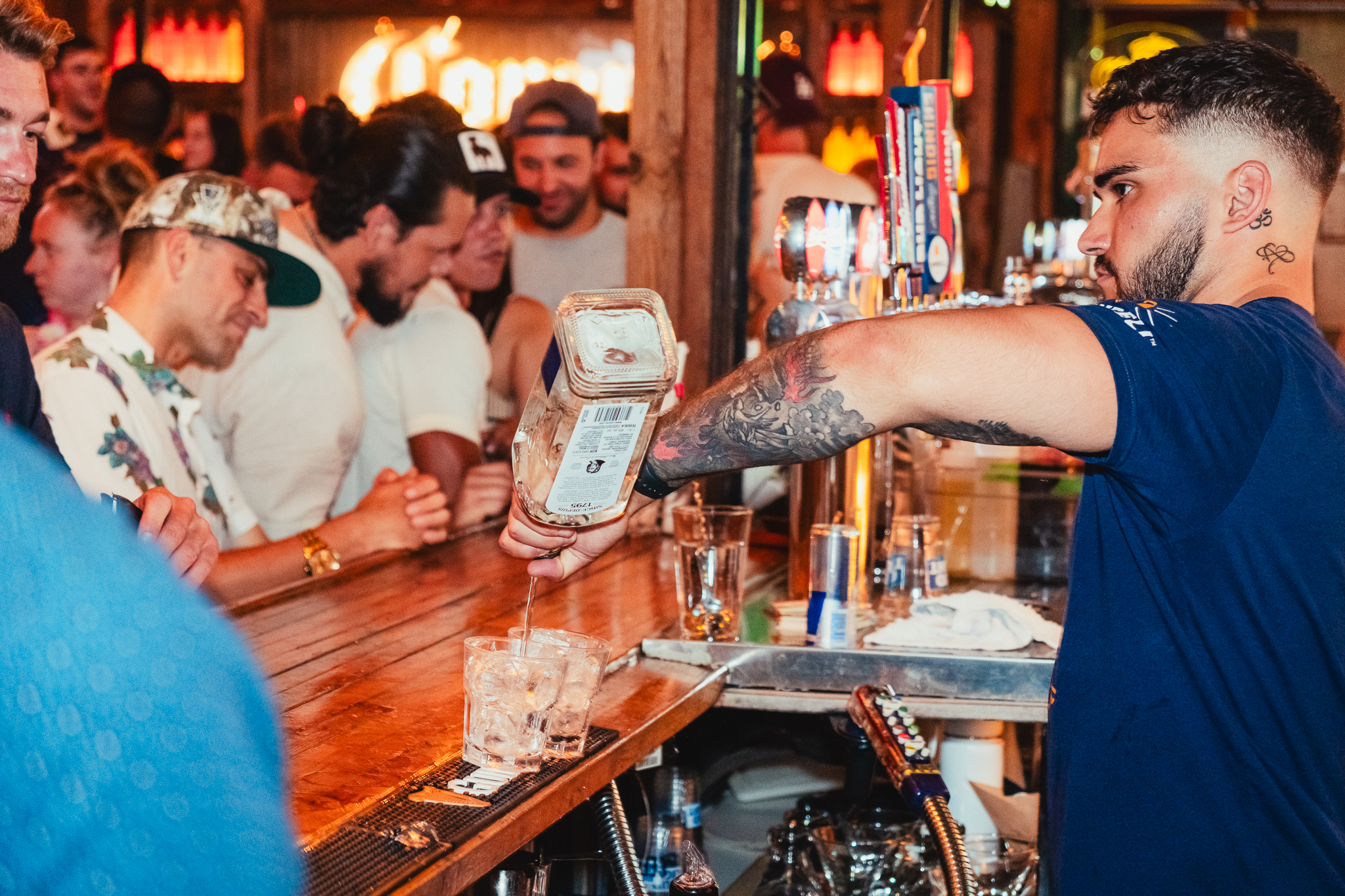 Bartendar pouring shots